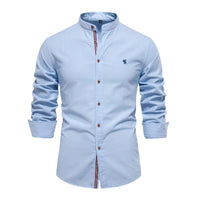 Thumbnail for Light blue shirt with rolled-up sleeves on a white background