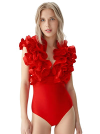 Thumbnail for Woman wearing a red swimsuit with floral details on a white background