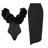 Thumbnail for Black swimsuit with ruffled details and a black skirt on a white background