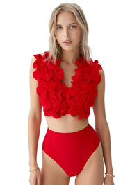 Thumbnail for Woman wearing a red floral bikini top and high-waisted bottoms on a white background