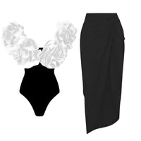 Thumbnail for Black swimsuit with white ruffled top and black skirt on a white background