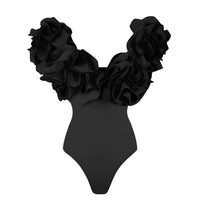 Thumbnail for Black swimsuit with floral straps on a white background