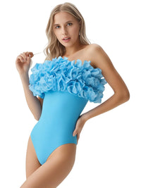 Thumbnail for Woman wearing a blue strapless swimsuit with ruffled top on a white background