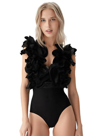 Thumbnail for Woman wearing a black ruffled swimsuit on a white background