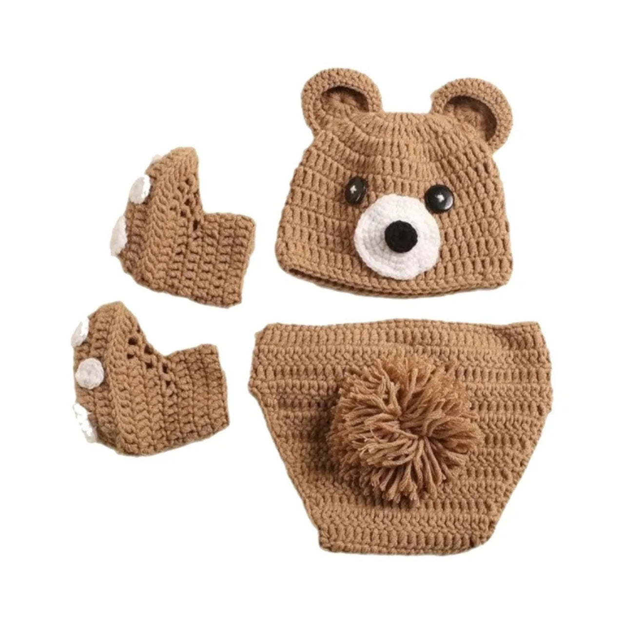 Crocheted brown bear hat, diaper cover, and booties set on a white background