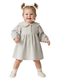Thumbnail for Baby wearing a light gray dress with lace on collar on a white background