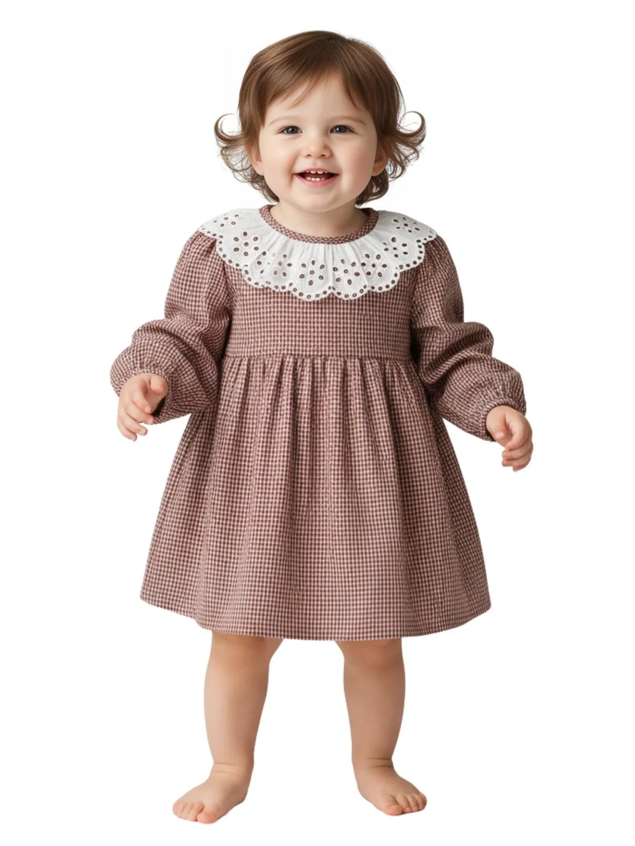 Child wearing a brown checkered dress with a white collar on a white background