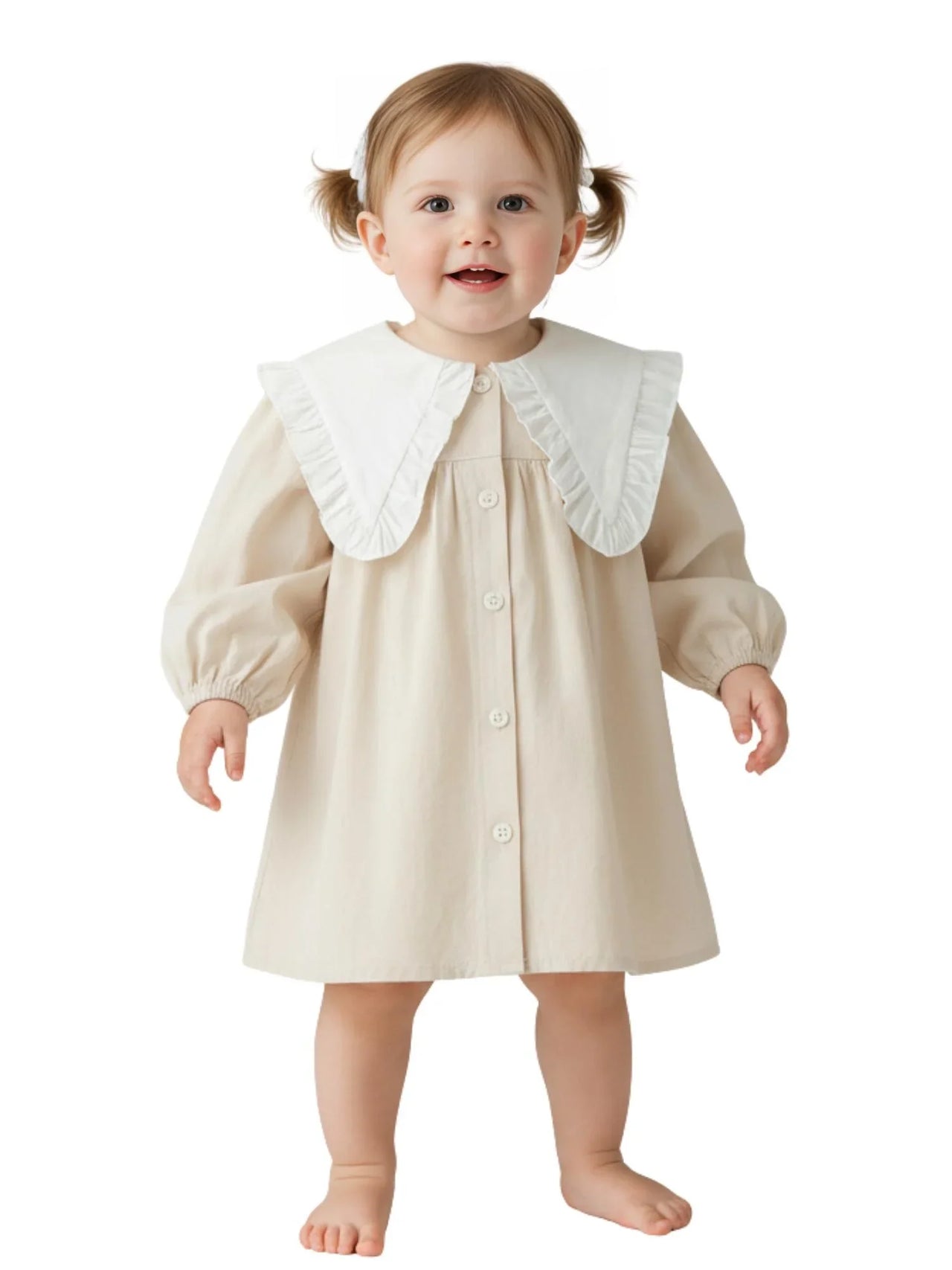 Baby wearing a beige dress with a white ruffled collar on a white background