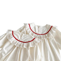 Thumbnail for White dress with red trim on a white background