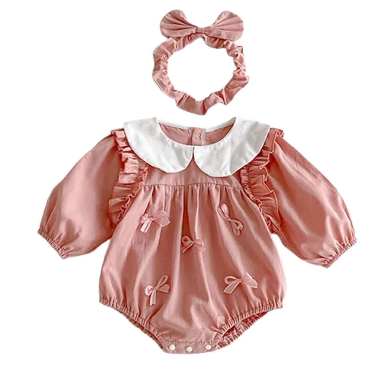 Pink baby romper with white collar and matching headband on a white background