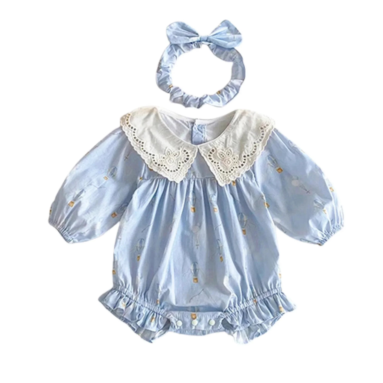Baby romper with lace collar and matching headband on a white background
