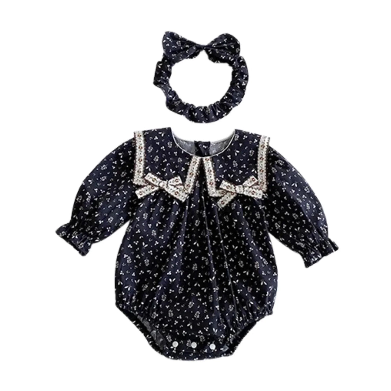 Baby romper with bow and matching headband on a white background