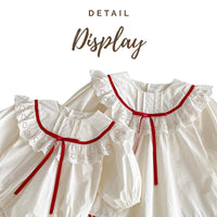 Thumbnail for White baby dresses with red trim on a white background