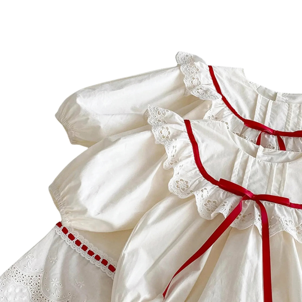 White dress with red trim on a white background