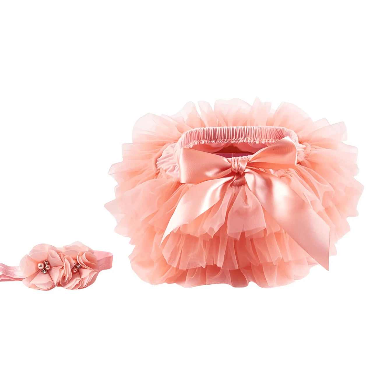 Pink tutu and headband set on a white background