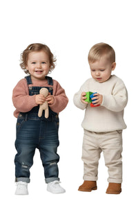 Thumbnail for Two children, a girl and a boy, standing side by side on a white background.