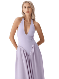 Thumbnail for Woman wearing a lavender halter neck dress on a white background