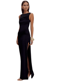 Thumbnail for Woman wearing a black sleeveless gown with a slit on a white background
