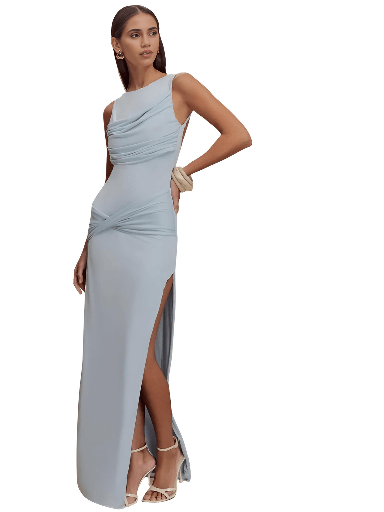 Woman wearing a light blue one-shoulder gown with a slit on a white background