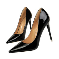 Thumbnail for Black high-heeled pumps with a white background
