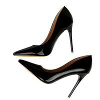 Thumbnail for Black high-heeled shoes on a white background