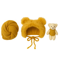 Thumbnail for Set of yellow baby hat, newborn wrap, and teddy bear on a white background