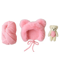 Thumbnail for Set of pink baby hat, newborn wrap, and teddy bear on a white background