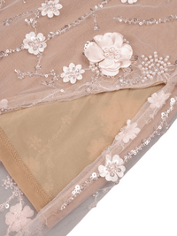 Thumbnail for Beige fabric with floral lace trim and embellishments on a neutral background