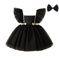 Thumbnail for Black polka dot dress with ruffled sleeves and a matching bow on a white background