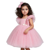 Thumbnail for Young girl wearing a pink dress with white accents on a white background