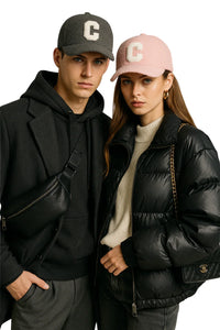 Thumbnail for Two people wearing matching caps with a letter 'C' on a white background