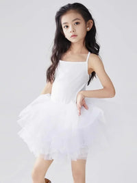 Thumbnail for Young girl wearing a bright white ballet tutu dress with thin straps against a plain background