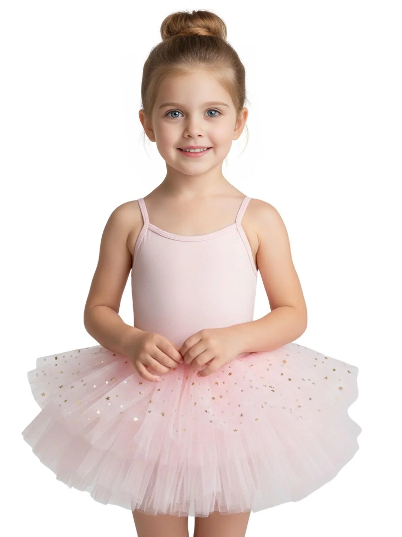 Young girl wearing a light pink glitter ballet tutu dress with thin straps on a white background