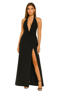 Thumbnail for Woman wearing a black halter neck gown with a high slit on a white background
