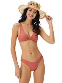Thumbnail for Woman wearing a salmon pink bikini and straw hat on a white background