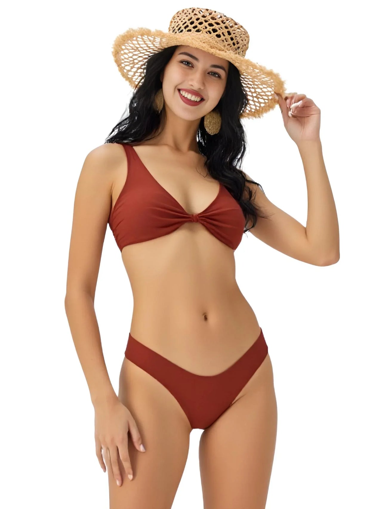 Woman wearing a brown bikini and straw hat on a white background