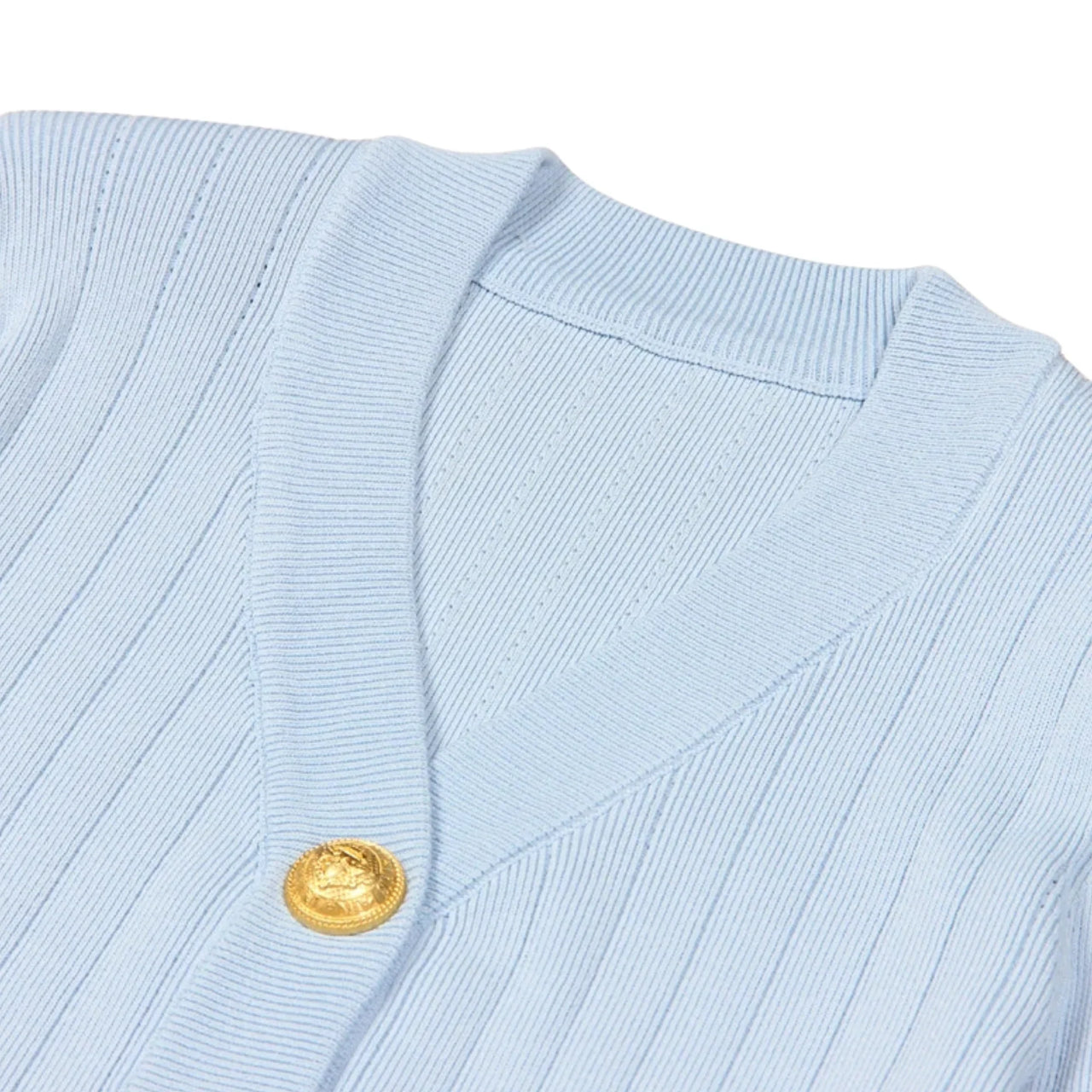 Light blue cardigan with a gold button on a white background