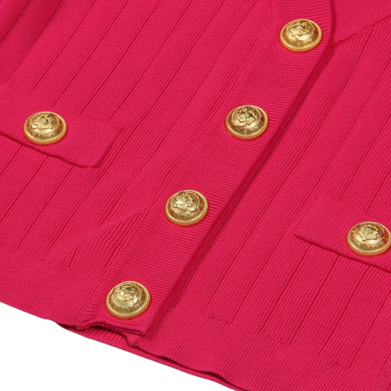Close-up of a red fabric with gold buttons on a white background