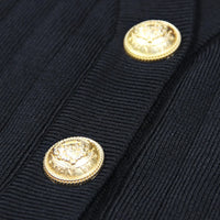 Thumbnail for Close-up of a navy blue jacket with gold buttons