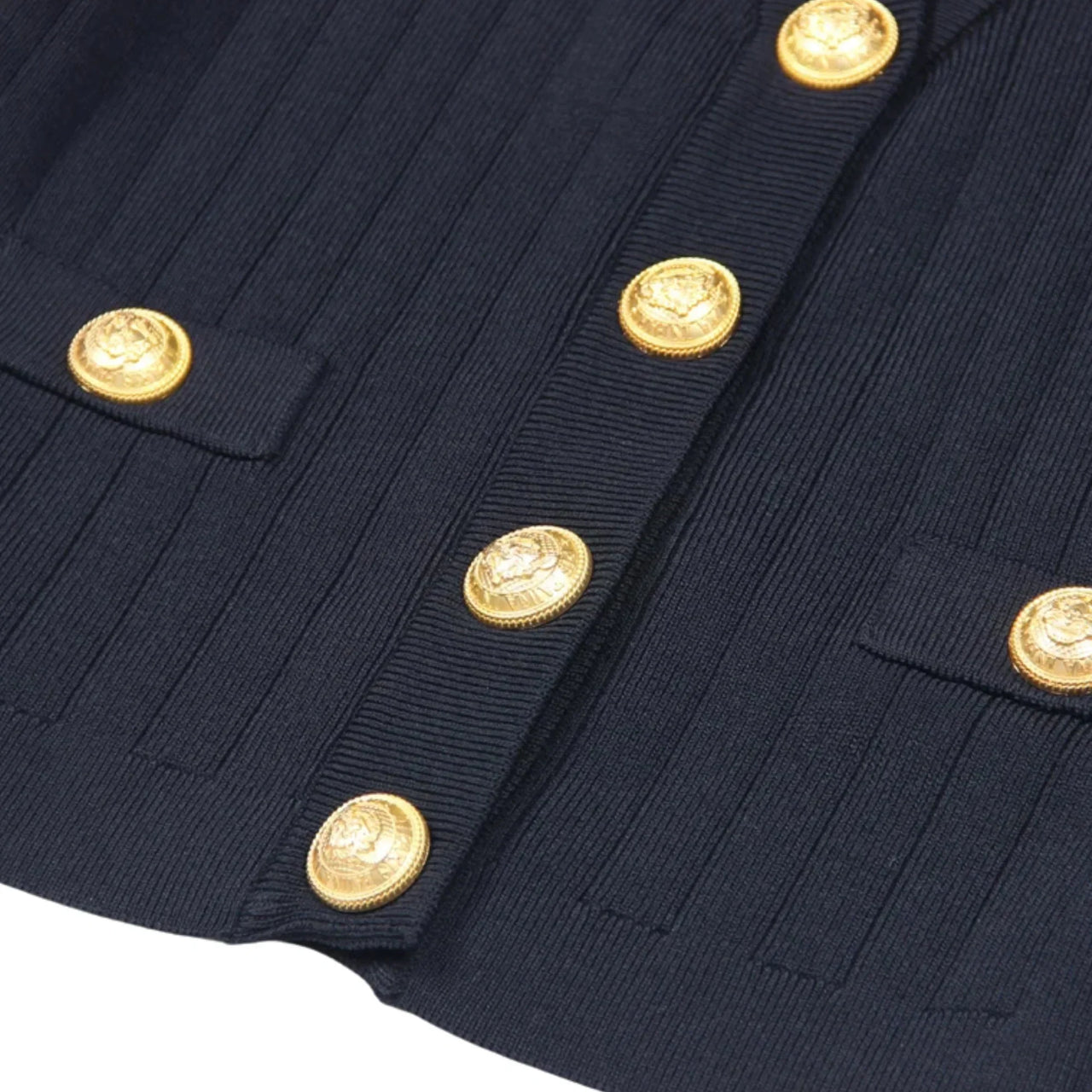 Navy blue fabric with gold buttons on a white background