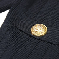 Thumbnail for Close-up of a gold button on a dark blue fabric background