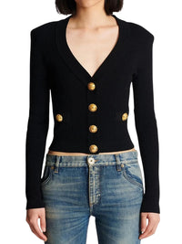 Thumbnail for Black cardigan with gold buttons worn by a woman on a white background