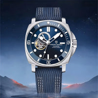 Thumbnail for Luxury watch with blue strap and dark blue dial against a mountainous landscape background