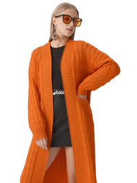 Thumbnail for Woman wearing an orange cardigan over a black dress on a white background