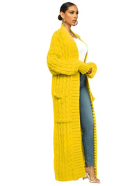 Thumbnail for Woman wearing a long yellow cardigan over a white top and blue jeans on a white background