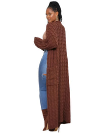 Thumbnail for Woman wearing a long brown cardigan over a blue outfit on a white background