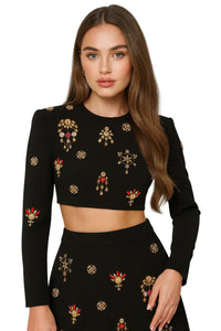 Thumbnail for Woman wearing a black skirt set with rhinesones on a white background