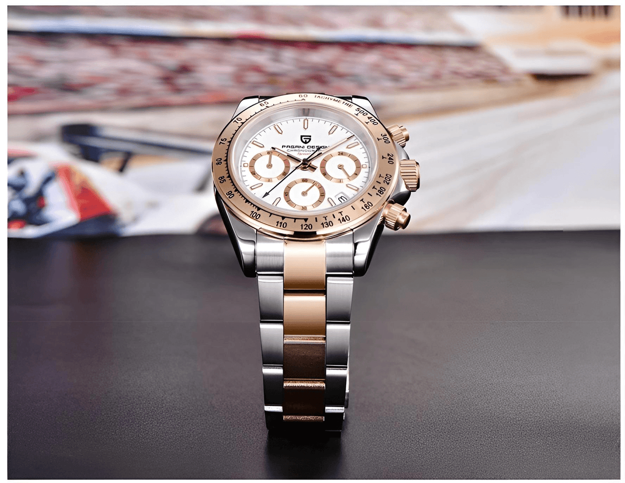 Luxury watch with silver and rose gold band on a dark surface.