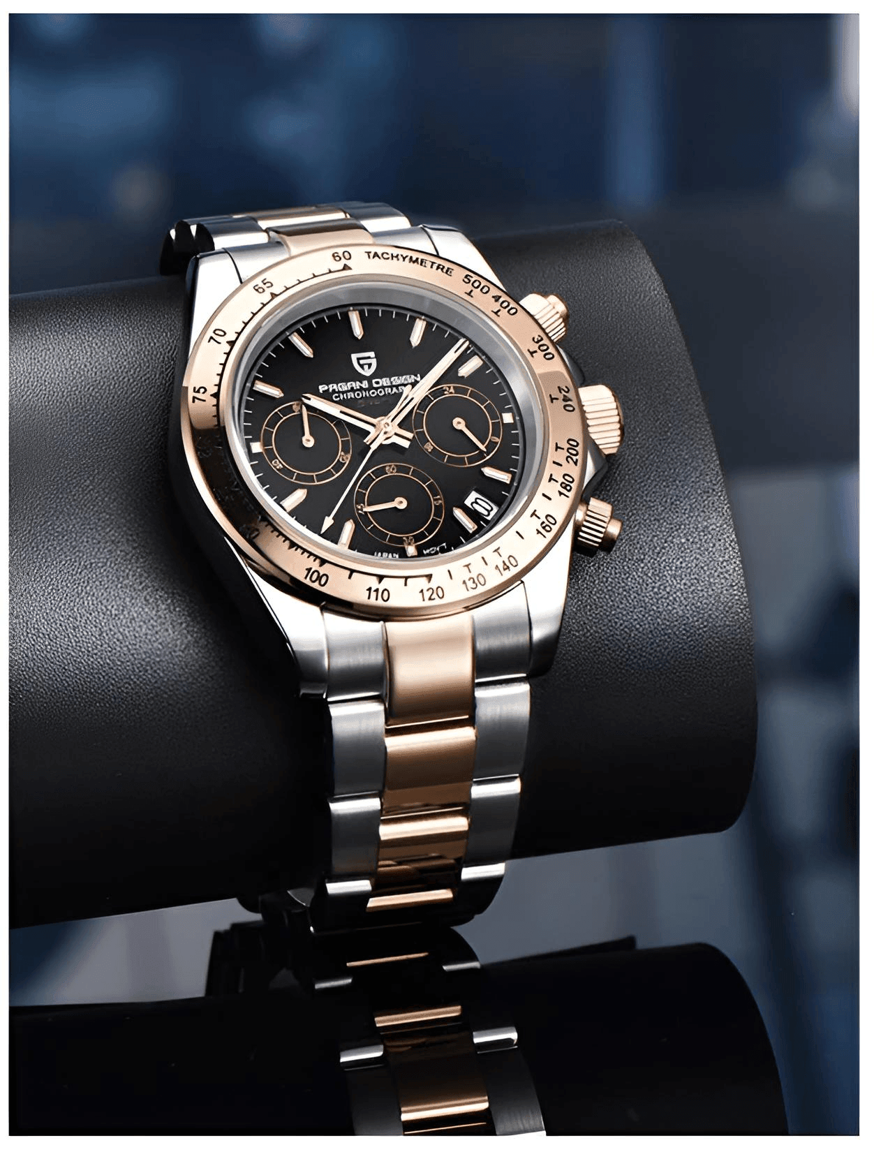Luxury watch with black dial and gold accents on a dark background