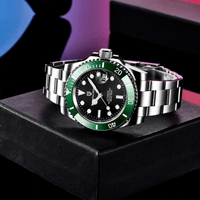 Thumbnail for Luxury watch with green bezel and silver band on a black box